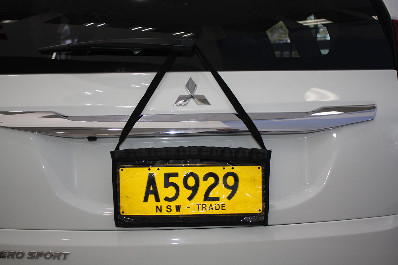 Rubber Trade Plate Holders & Four (4) License Plate Holders